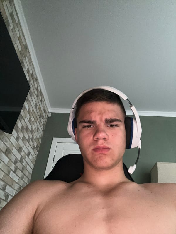 Gaming headphones and a glowing smartwatch in a home setup