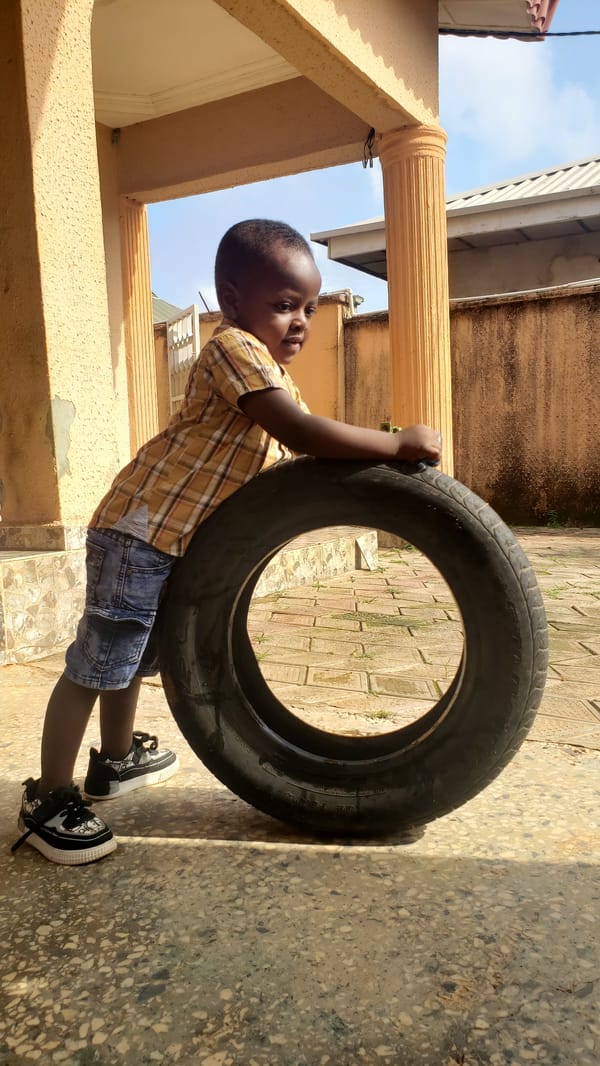 Backyard play with toys and a tire, Sabon Tasha