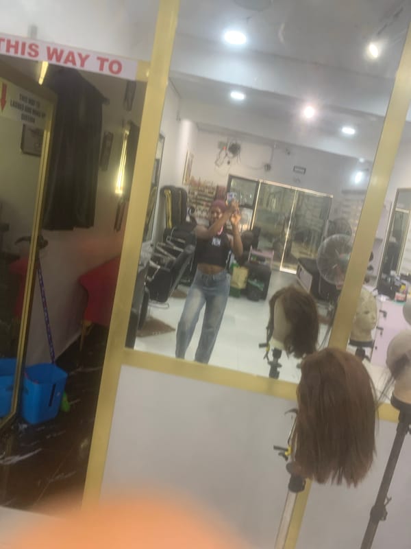 Mirror selfie and street scene captured simultaneously
