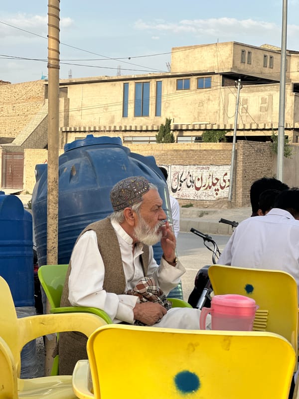 Men gather for outdoor meeting in Quetta, Pakistan