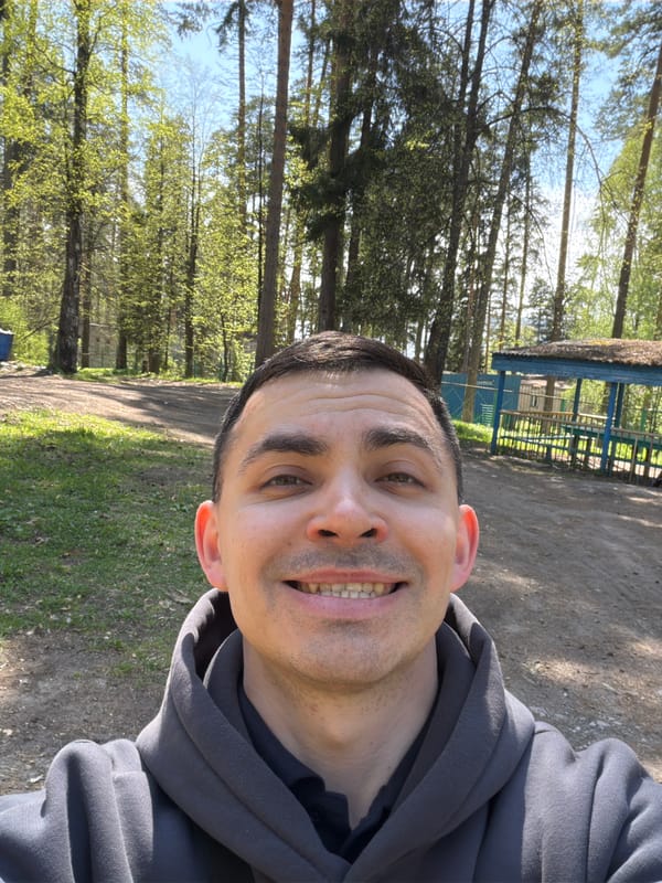 Man photographed smiling on forest path in Izhevsk
