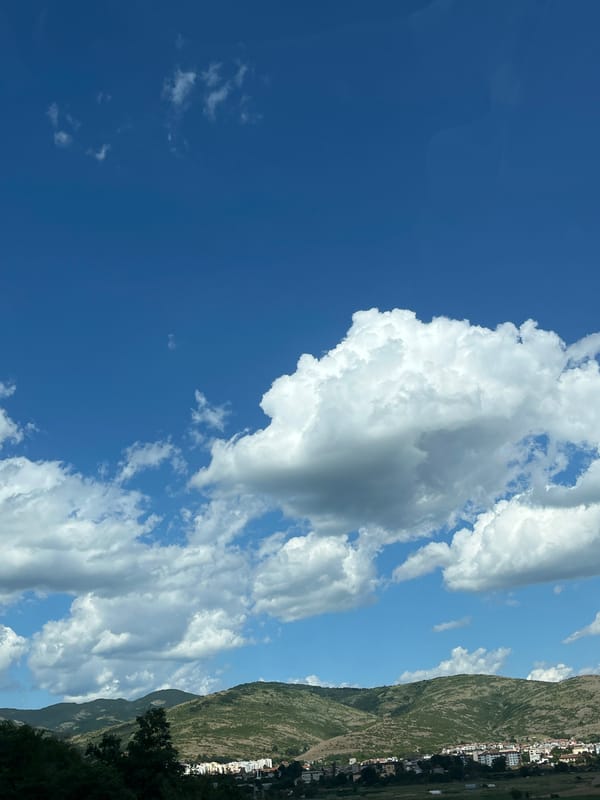 Panoramic views of Sedlari countryside under cloudy blue skies
