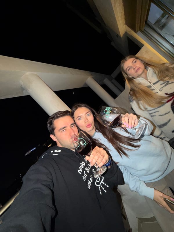 Evening rooftop gathering with wine and grilling in Tel Aviv