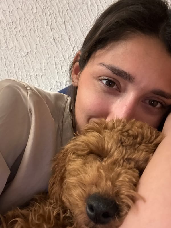 Woman takes selfie, poodle photographed in Sutomore, Montenegro
