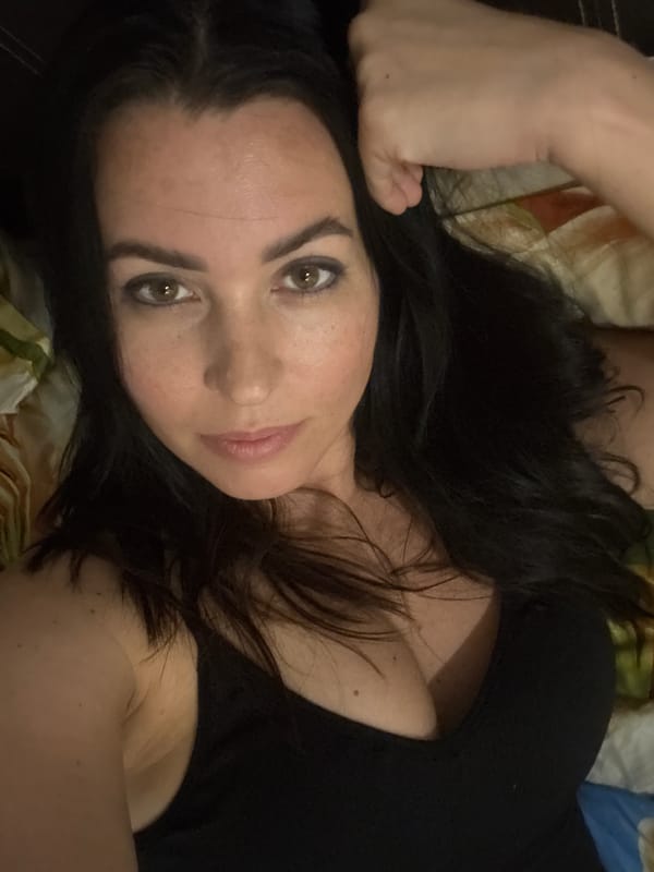 Woman photographed in bedroom setting in Pattaya, Thailand