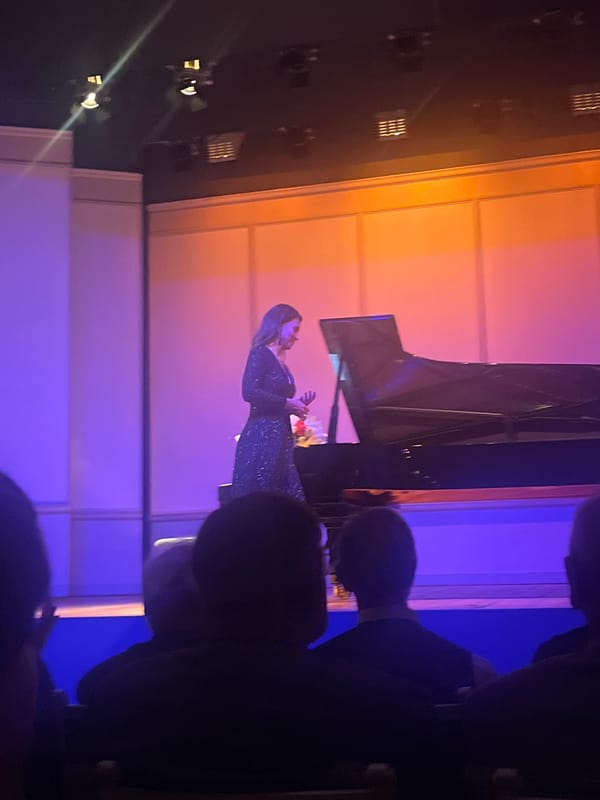 Female pianist performs concert with flowers in Berlin