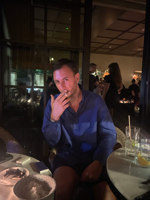 Late-night cigarettes and dinner at a dim London restaurant