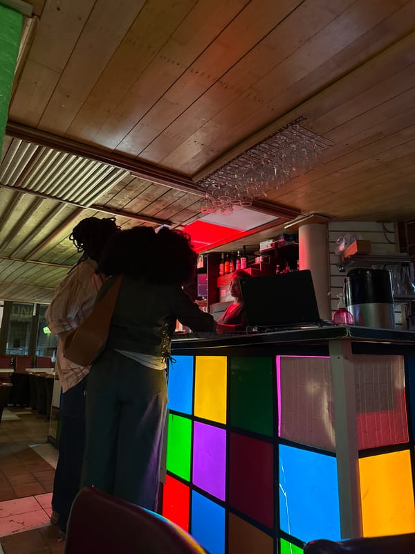 Dimly lit Paris bar interior photographed from unusual angle