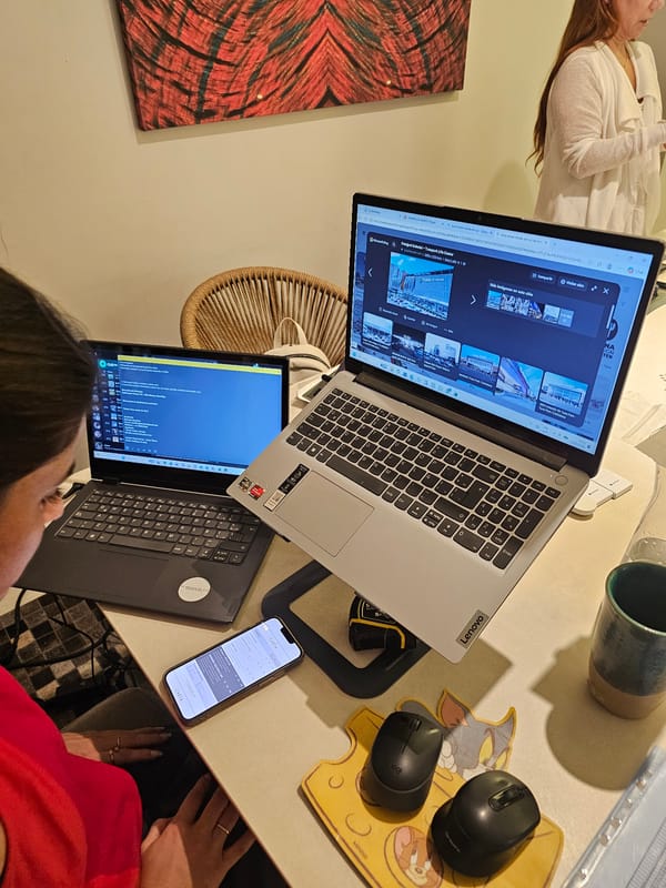 Two people work with laptop in Miraflores home workspace
