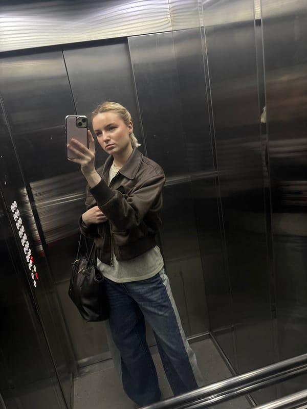 Woman photographed in building elevator and hallway in Vsevolozhsk