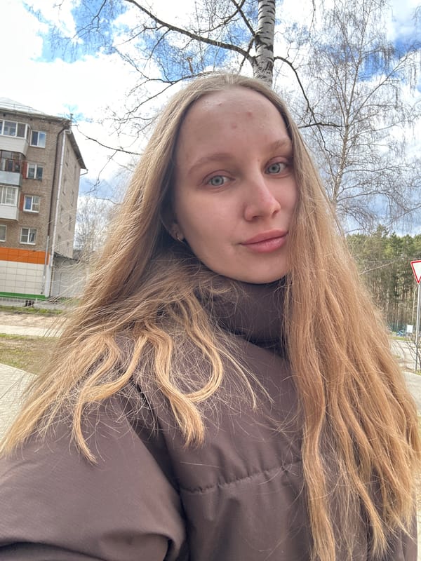 Woman photographed, flowers on steering wheel in Chaikovsky