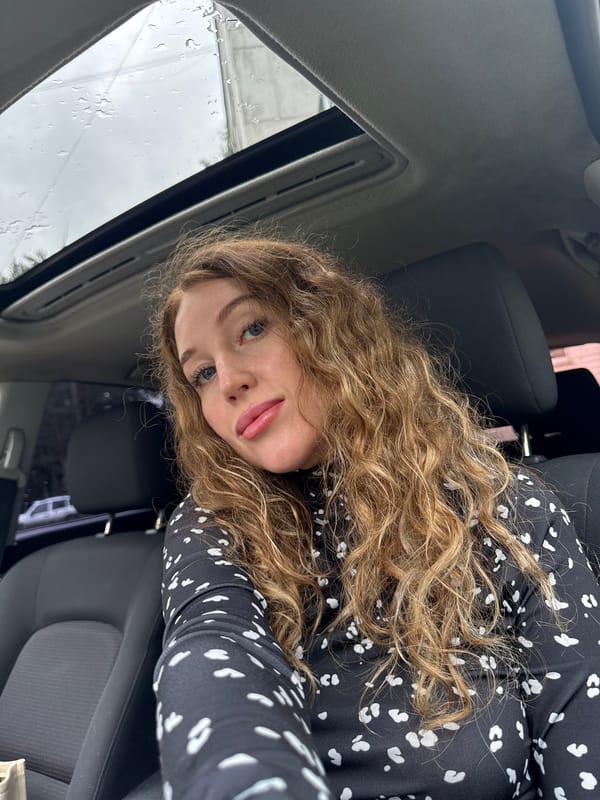 Rainy morning ride through Chaikovsky, passenger seat view