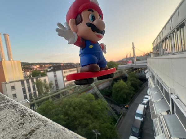 Mario figurine and Wuppertal street scenes on a June evening