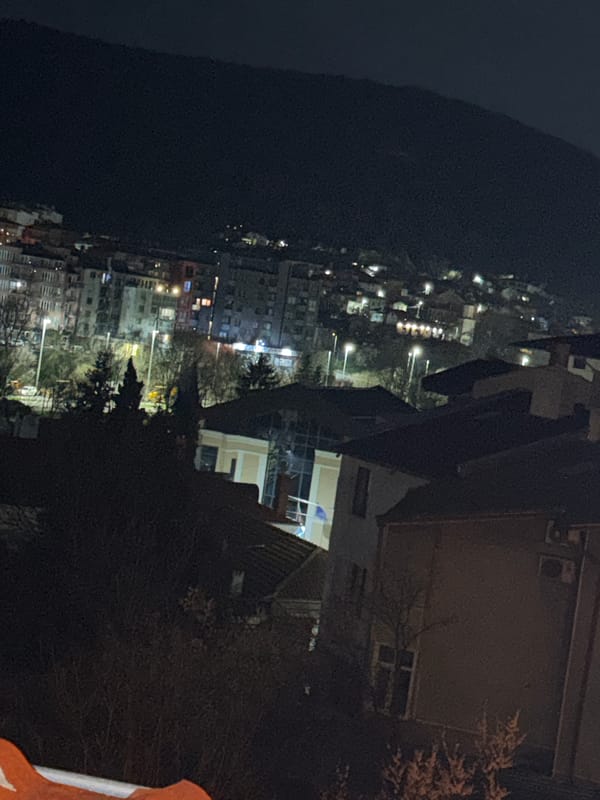 Night view captured of illuminated Shumen cityscape from above