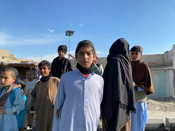 Afghan village witnesses road paving project with heavy machinery