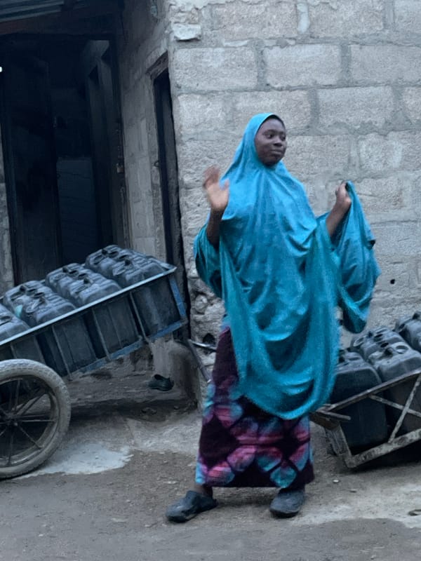 Urban community daily life documented through water collection, street activities