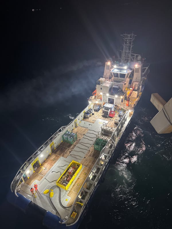 Cargo ship spotted at night in turbulent Italian waters