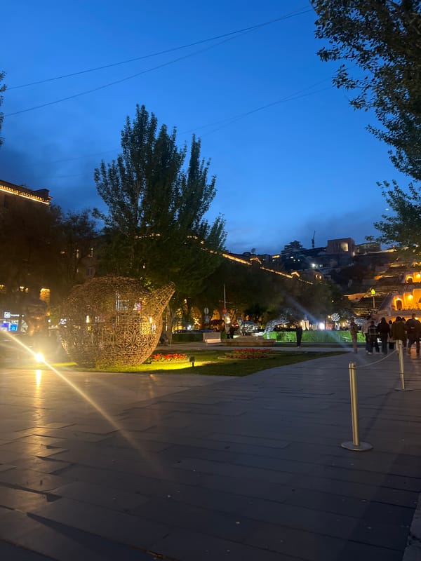 Illuminated teardrop sculpture observed at night in Yerevan