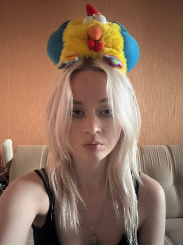 Close-up of a bold, colorful plush hat from a low angle