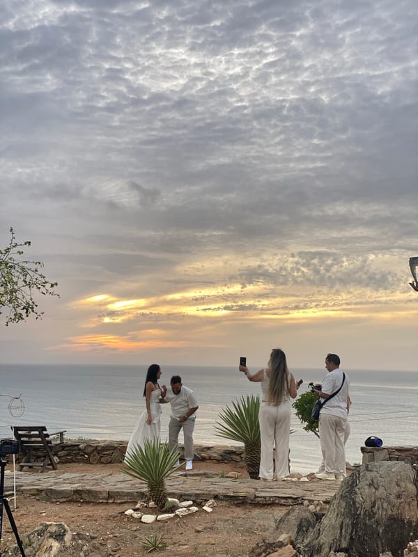 Marriage proposal captured at Juan Griego coastal overlook during sunset