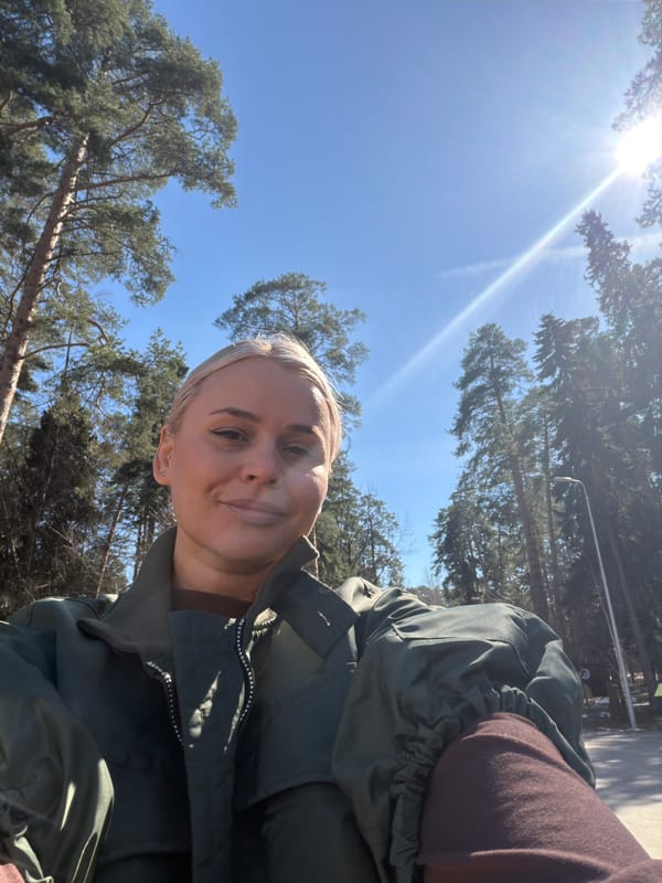 Woman in green jacket photographed at Leninsky Park, Sarapul