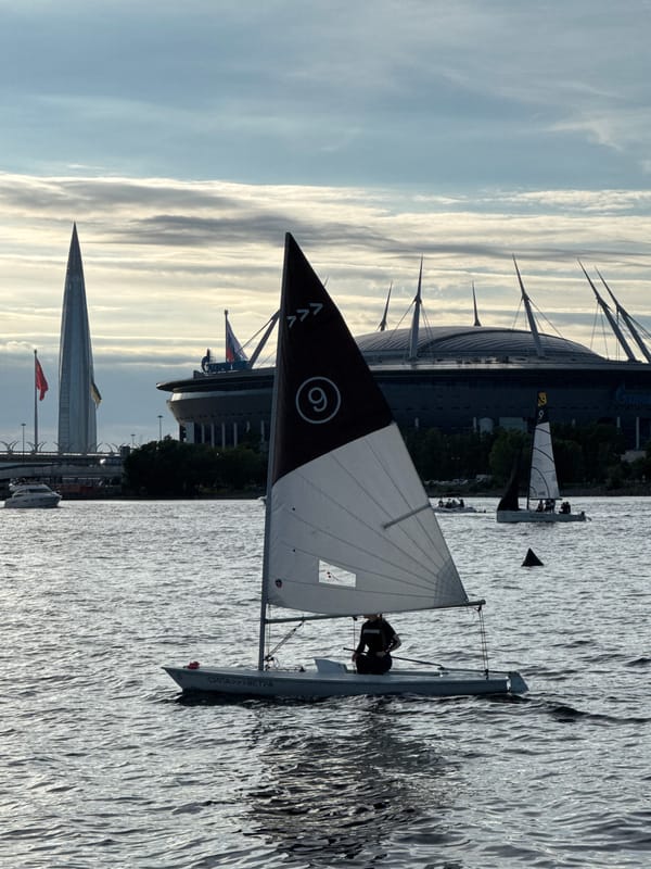 Regatta on the Neva with the WHSD bridge at sunset