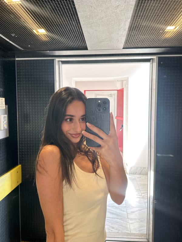 Woman takes selfies in Milan elevator, enjoys cookie break