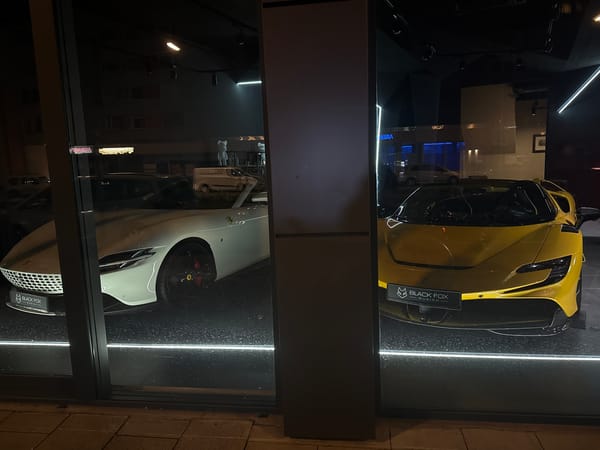 Luxury cars spotted outside Munich storefront Tuesday evening