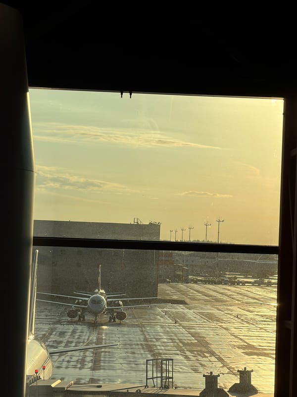 Early morning airport scene captured with aircraft, wet tarmac