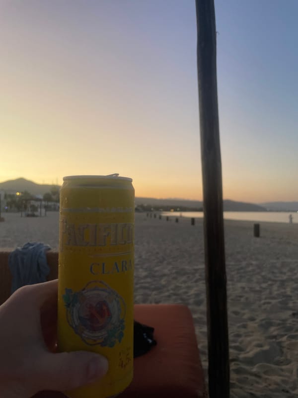 Beach moments captured with beer during sunset in Buenavista
