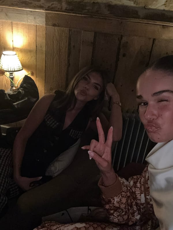 Two women take selfie indoors in West Oxfordshire evening
