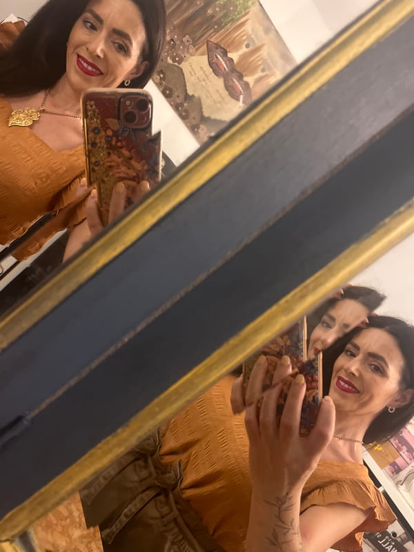 Woman takes mirror selfie in decorated interior, Konz Germany