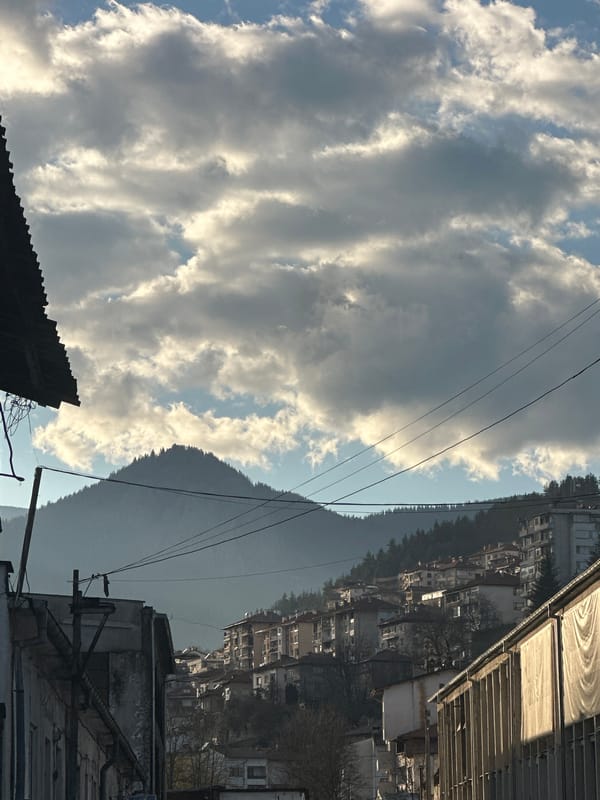 Everyday moments captured in Smolyan: rooftops and car repair