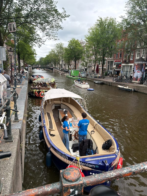 Midday stroll through Amsterdam's canals and brick streets