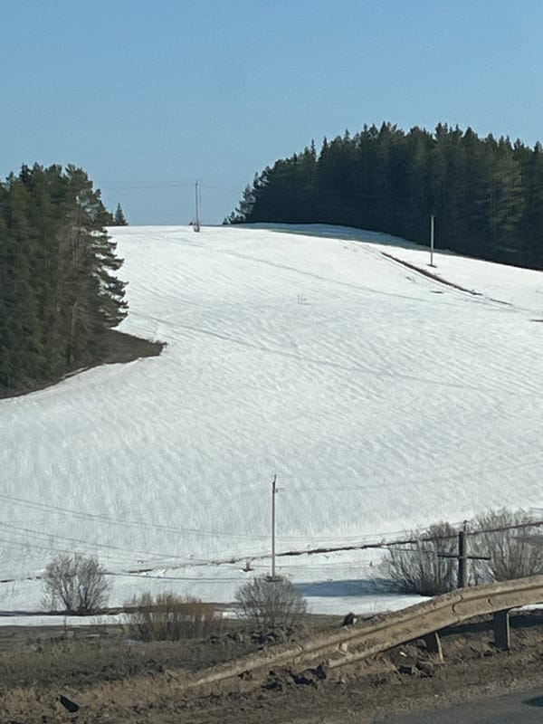 Snow-covered field observed near Russian village