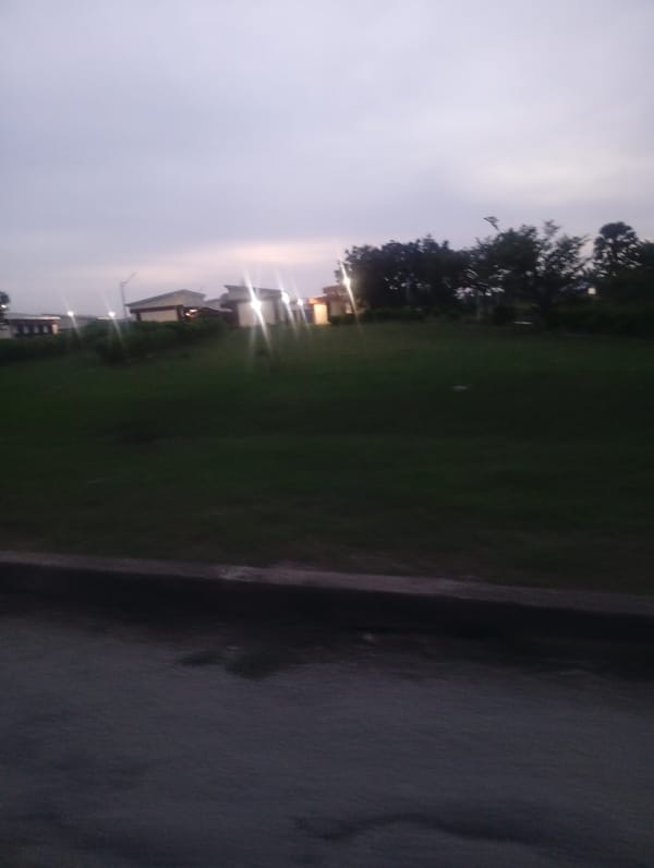 Evening activity across an institutional campus in Jos, Nigeria