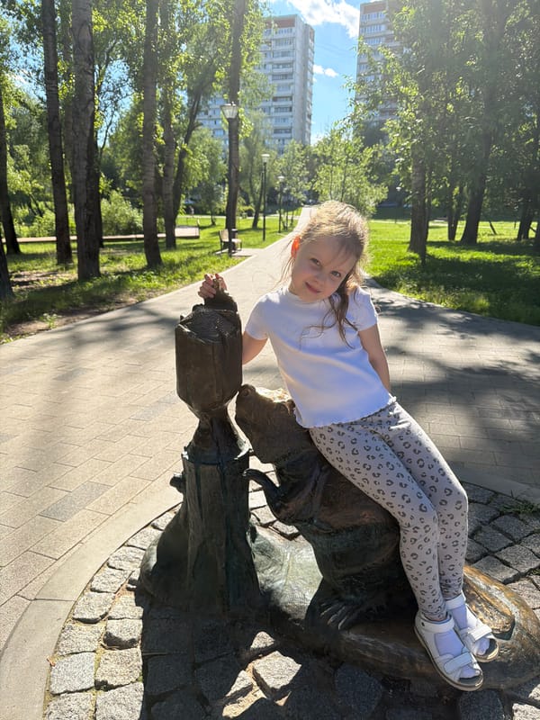 Sunny afternoon in a Moscow park with wildlife and peonies