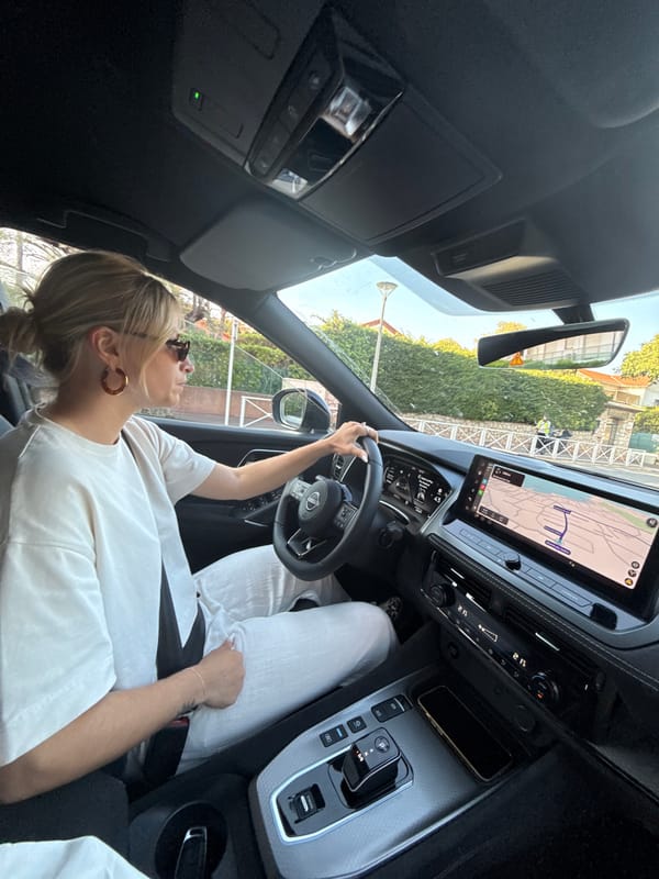Woman photographed in car driver's seat in Antibes, France