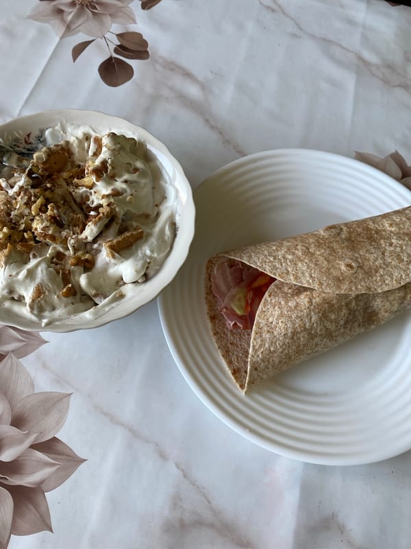 Breakfast burrito and ice cream photographed from above