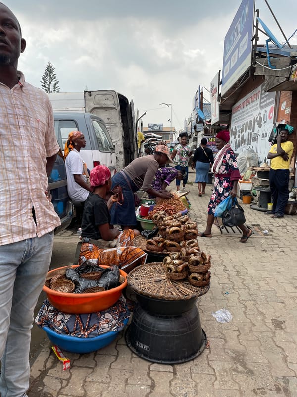 Street vendors sell goods at Ikeja marketplace