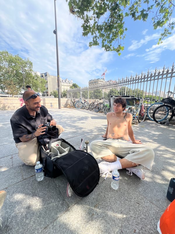 Casual skateboarding session at a sunny Paris plaza