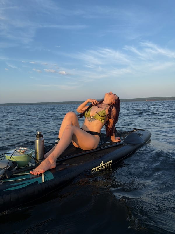 Summer water recreation on a wide Russian river in Chaikovsky