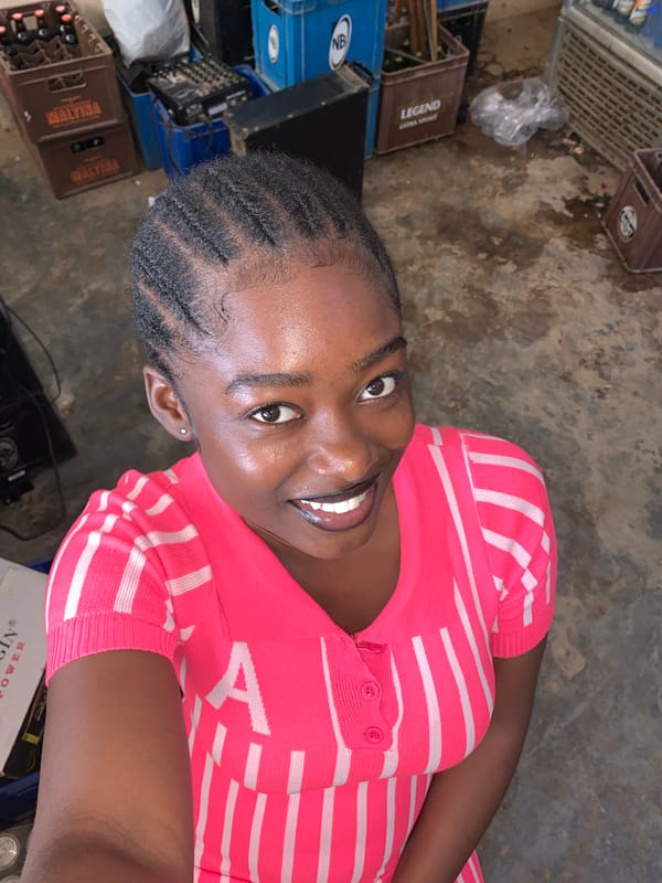 Woman in striped top photographed across Nigerian cities