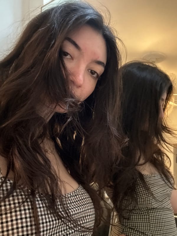 Woman takes selfies in NYC apartment Thursday evening