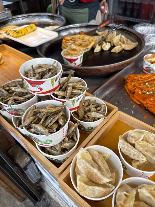 Tourists explore Zhangjiajie National Park, take selfies, sample street food