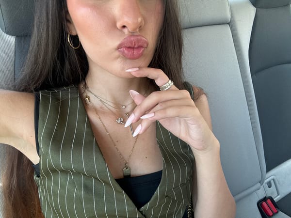 In-car selfie session near Hallandale Beach with a welcome sign