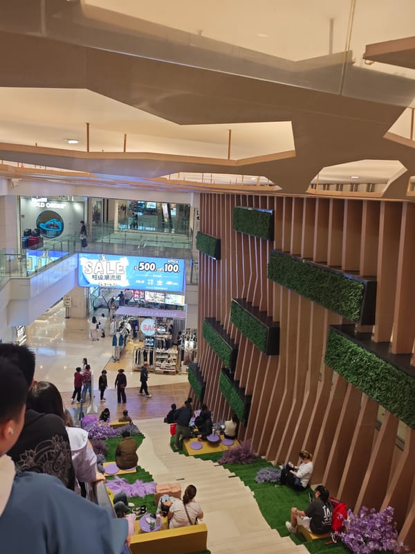 Morning shoppers browse modern mall in Chongqing's Yuzhong District