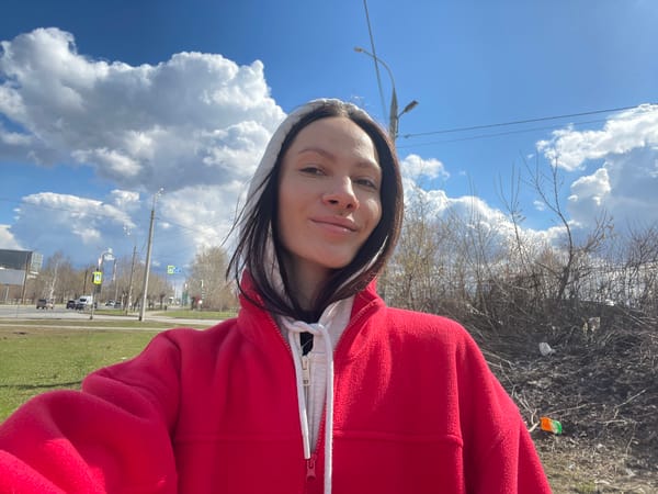 Woman takes morning selfies under cloudy sky in Izhevsk