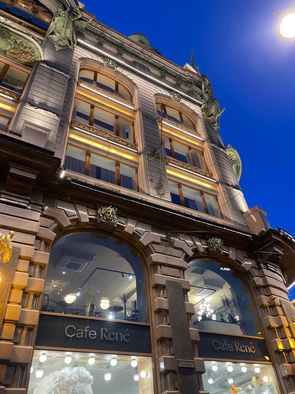 Ornate illuminated building photographed at night in Saint Petersburg