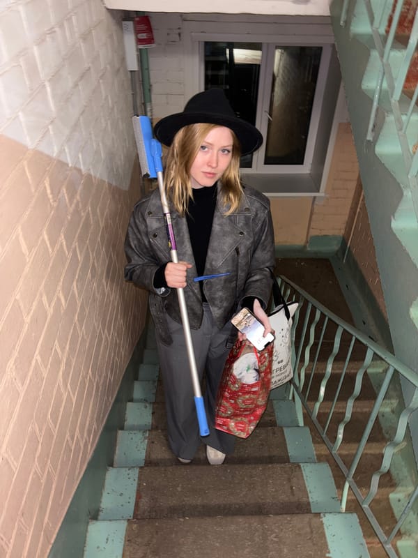 Young person photographed on indoor staircase in Perm building